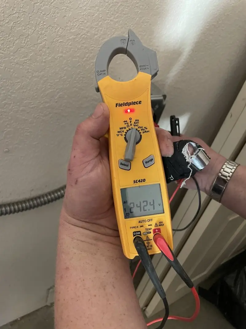 Voltage testing with clamp meter during Recessed Lighting Installation in Hot Springs Village